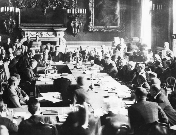 Politicians and dignitaries sitting around a large table