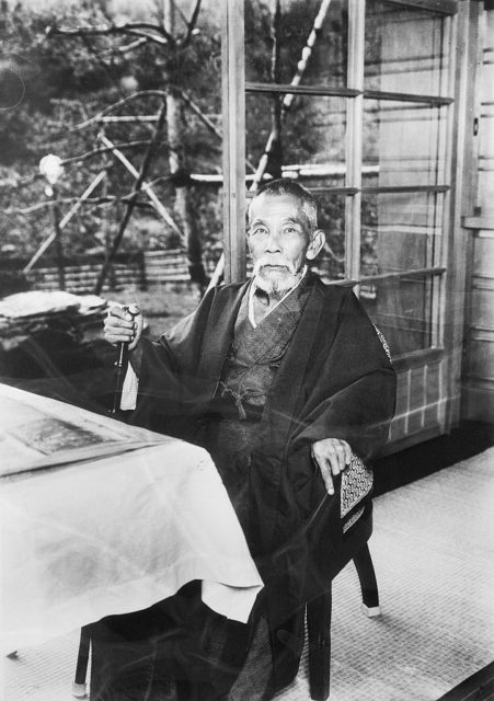 Japanese Prime Minister Inukai Tsuyoshi sitting at a table