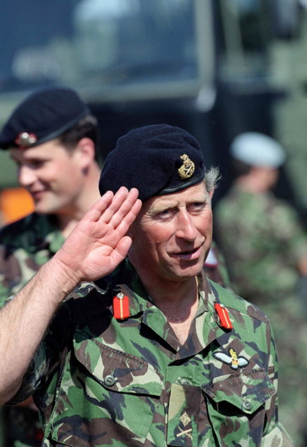 King Charles III saluting while in military uniform