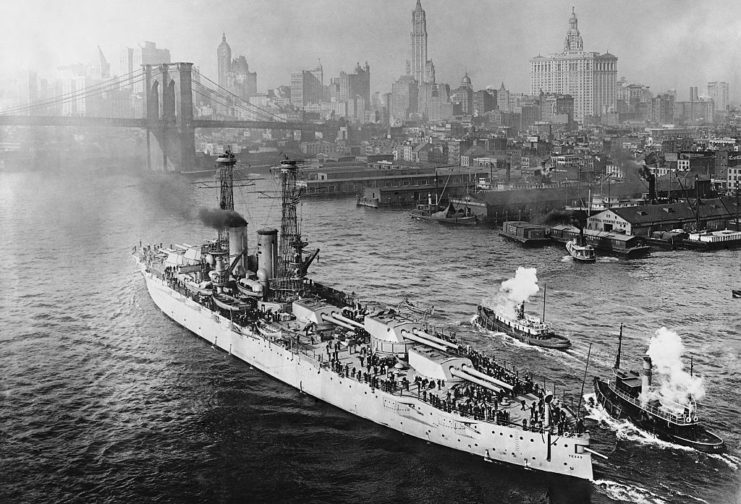 USS Texas and smaller boats sailing through New York Harbor