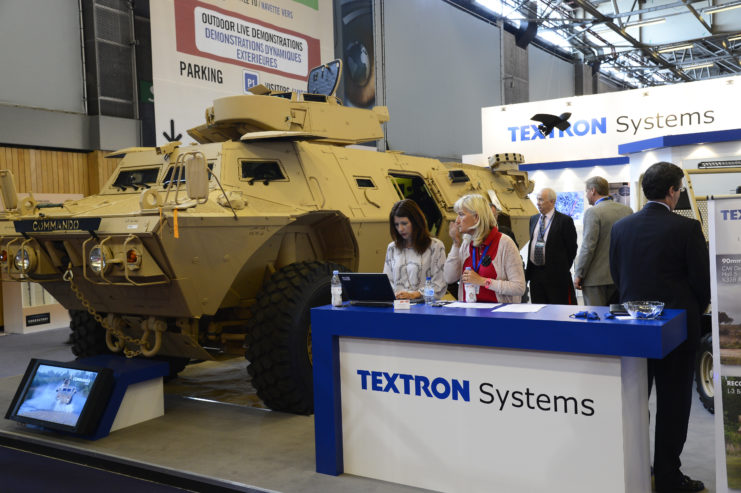 Textron Systems employees at a trade show booth