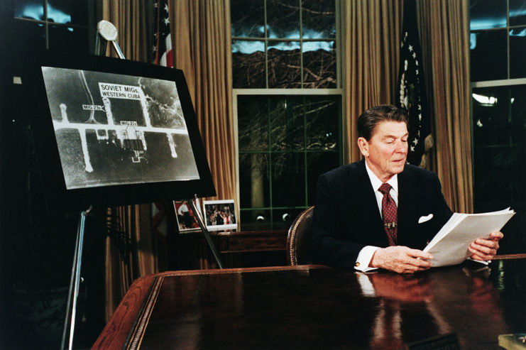 Ronald Reagan speaking at his desk in the Oval Office