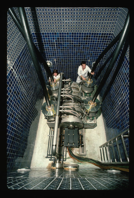 Susan Poor and Steven Hawkins working on an electron accelerator