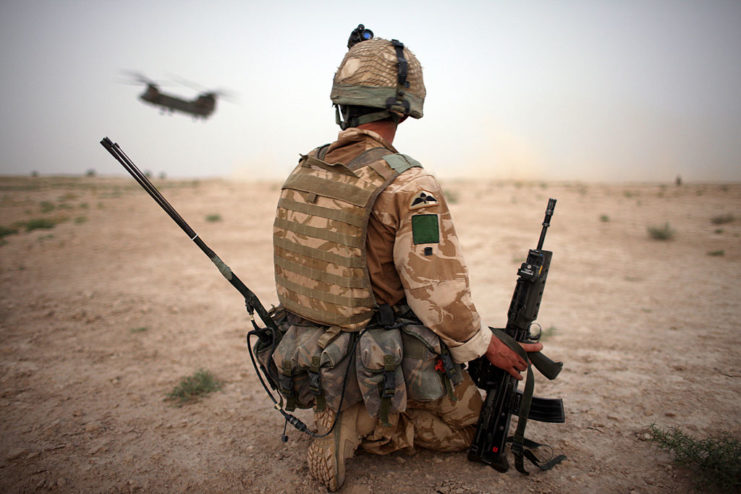 Soldier kneeling in the desert