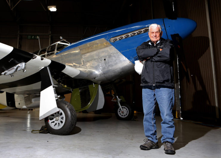 Bud Anderson standing in front of a North American P-51C Mustang