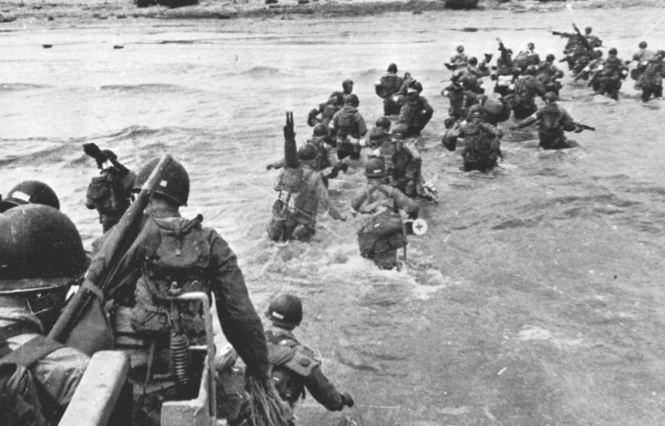 American troops wading through water toward Utah Beach