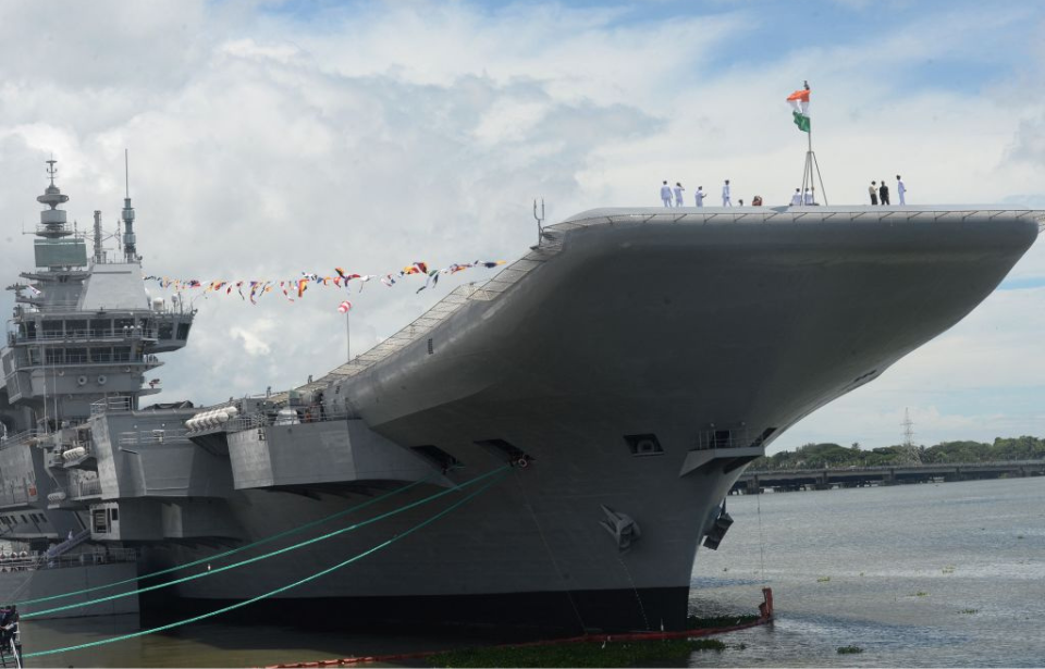 Indian Navy sailors standing on the deck of the INS Vikrant