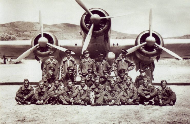 Members of the 281ª Squadriglia standing in front of an aircraft