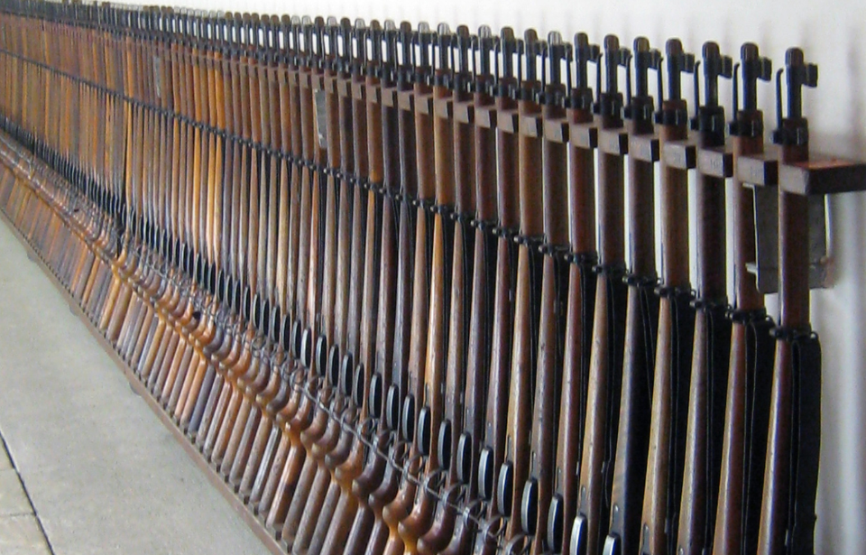 Swiss K31 rifles lined up against a wall