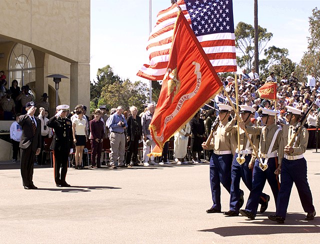 Mitchell Paige saluting graduates of the Marine Corps Recruit Depot, San Diego