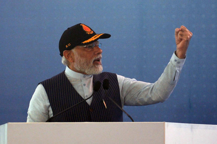 Narendra Modi speaking at a podium