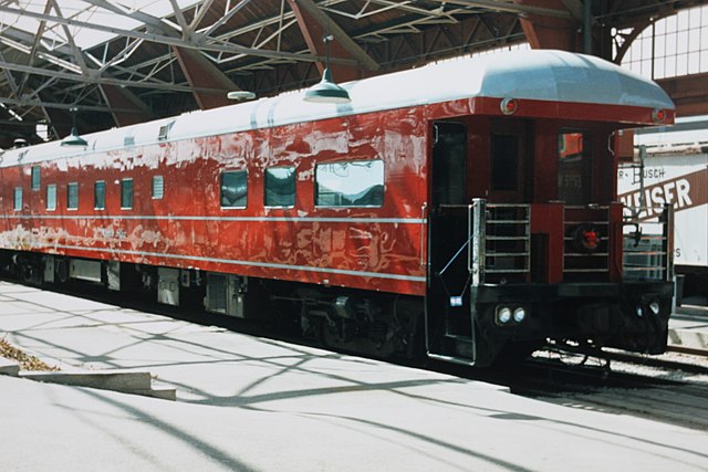 Pullman sleeper car stopped at a train station