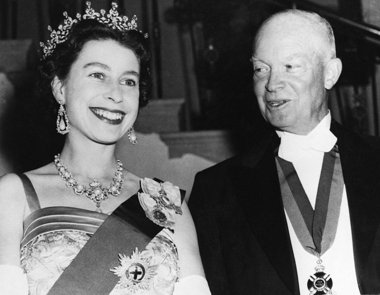 Dwight D. Eisenhower looking at a smiling Queen Elizabeth II