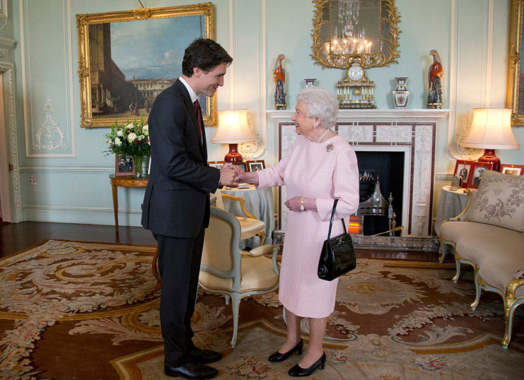 Justin Trudeau shaking hands with Queen Elizabeth II