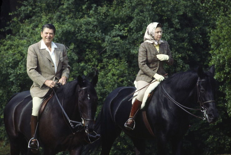 Ronald Reagan and Queen Elizabeth II riding on horseback