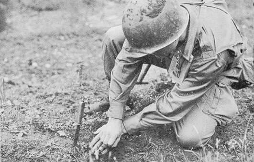 Soldier searching for landmines