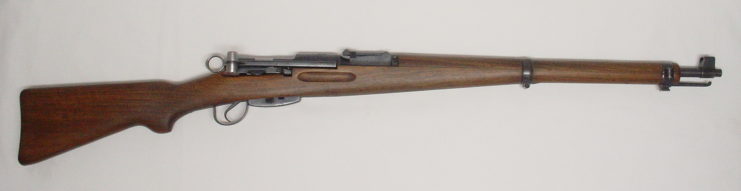 Swiss K31 rifle against a white backdrop