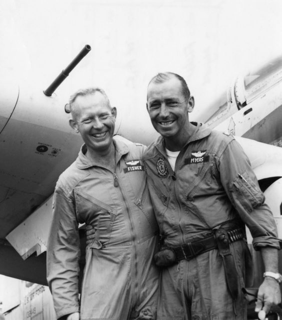 Bernard Fisher standing with Dafford Wayne "Jump" Myers