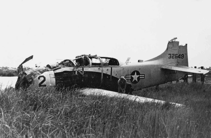 Damaged Douglas A-1E Skyraider in the grass