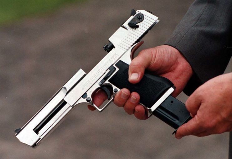 Close-up of a person chambering a Desert Eagle