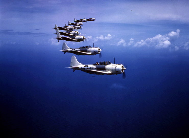 Nine Douglas SBD Dauntless dive bombers in flight