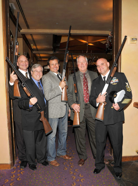 Patrick Kilpatrick, Sandy Climan, Tim Abell, Steve Kanaly and George Pens holding shotguns