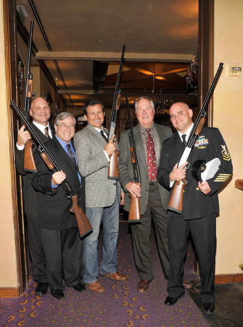 Patrick Kilpatrick, Sandy Climan, Tim Abell, Steve Kanaly and George Pens holding shotguns