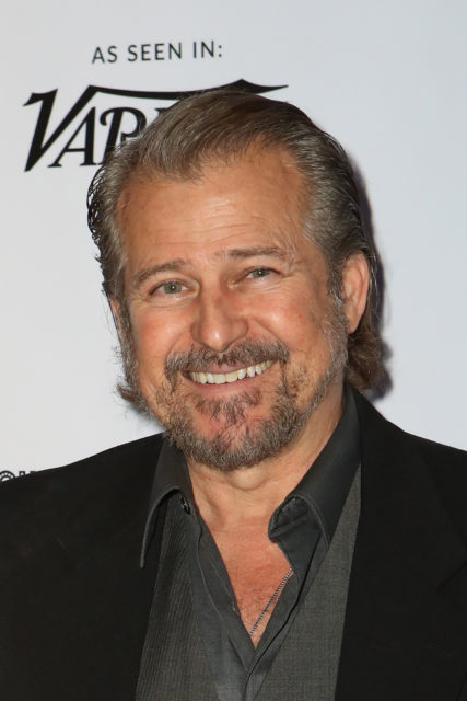 Tim Abell smiling while on a red carpet