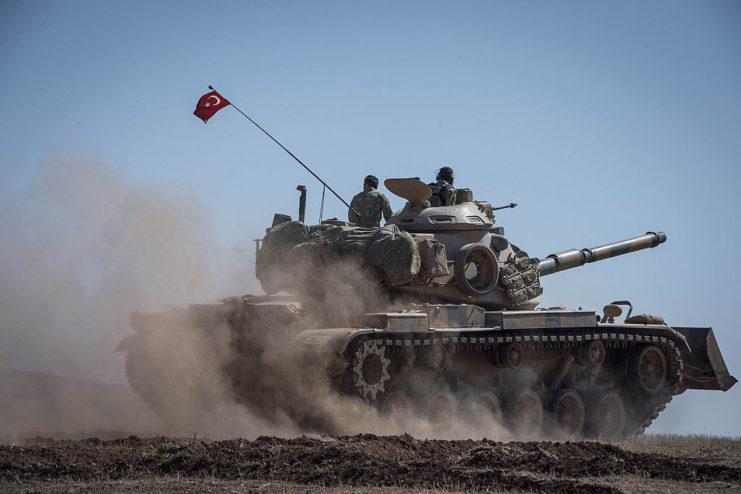 Soldiers driving a Leopard I through the desert