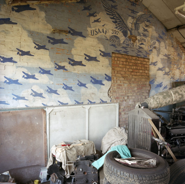 Mural of bomber aircraft painted on a brick wall