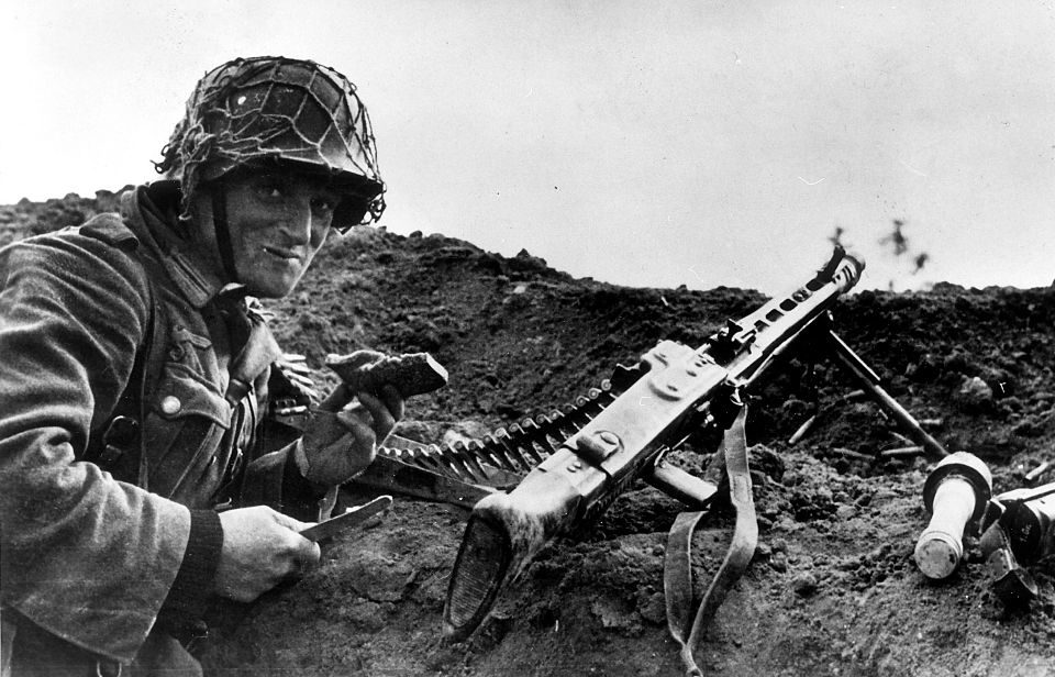 German soldier lying beside an MG-42