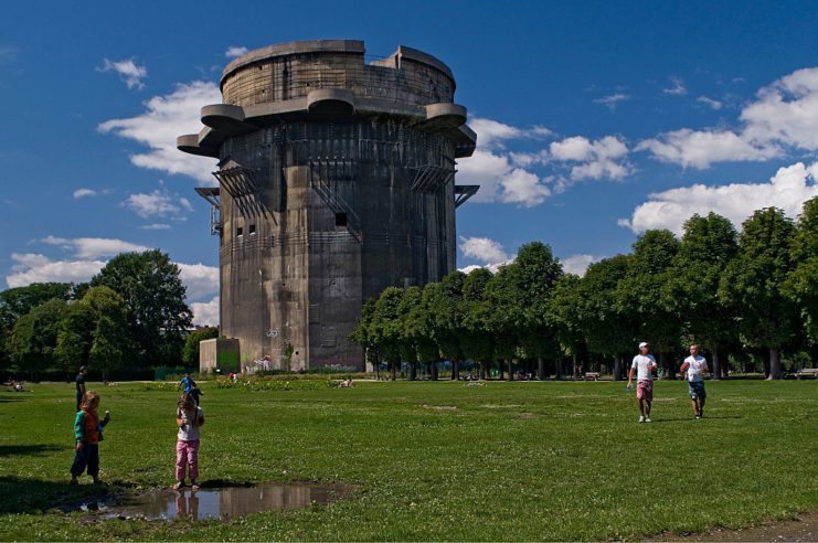 People walking near a flak tower