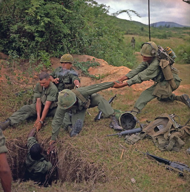 US soldiers pull a comrade out of a tunnel dug by the Viet Cong