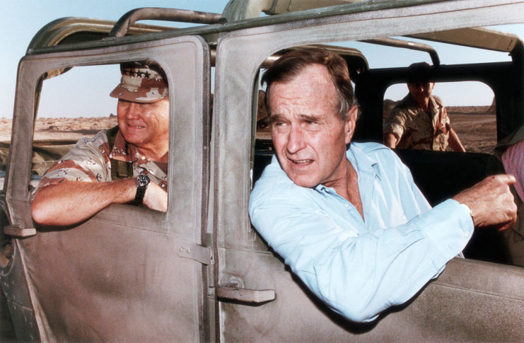 George Bush Sr in a military vehicle during Gulf War
