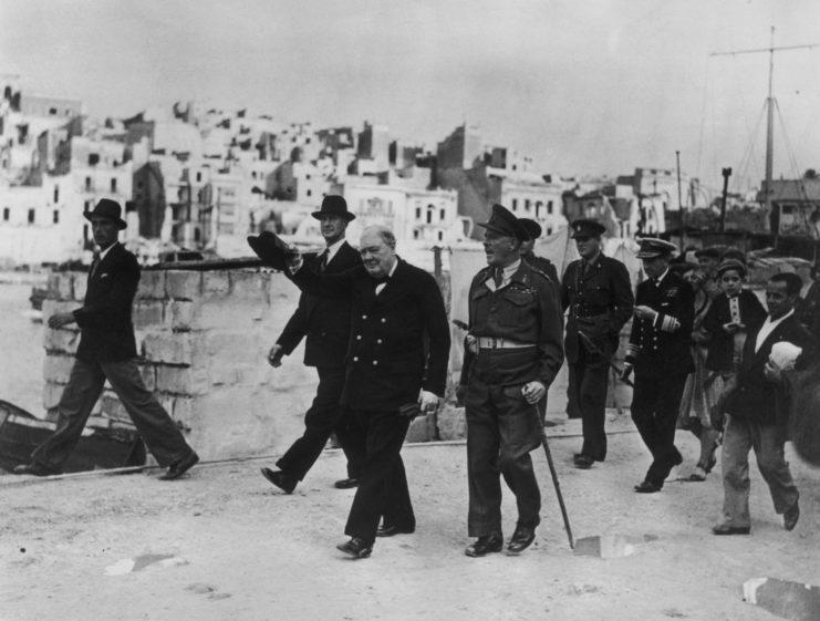 Winston Churchill walking with many people in Malta