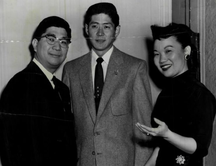 Hiroshi Miyamura standing with members of his family