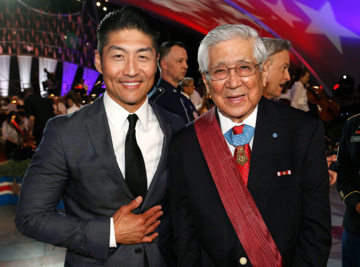 Brian Tee standing with Hiroshi Miyamura