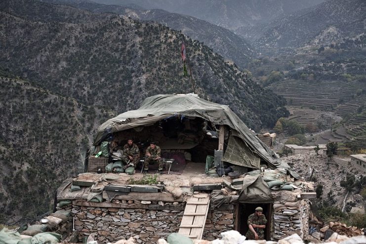 Three Afghan National Army soldiers stationed in the Korengal Valley
