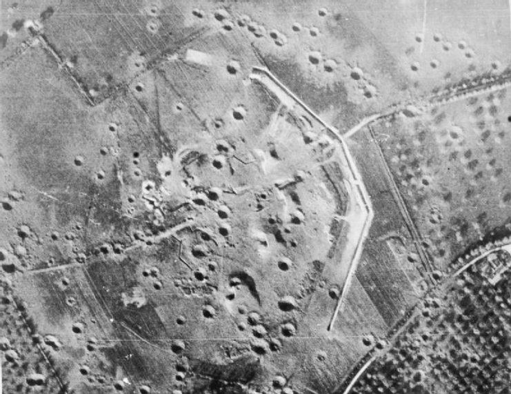 Aerial view of a pockmarked Merville Gun Battery