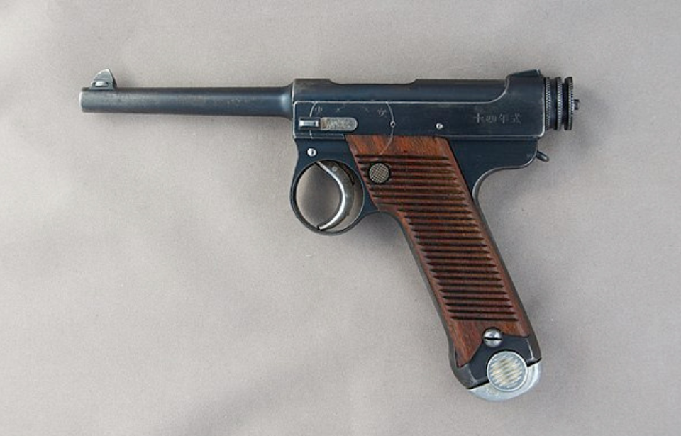 Nambu pistol against a white backdrop