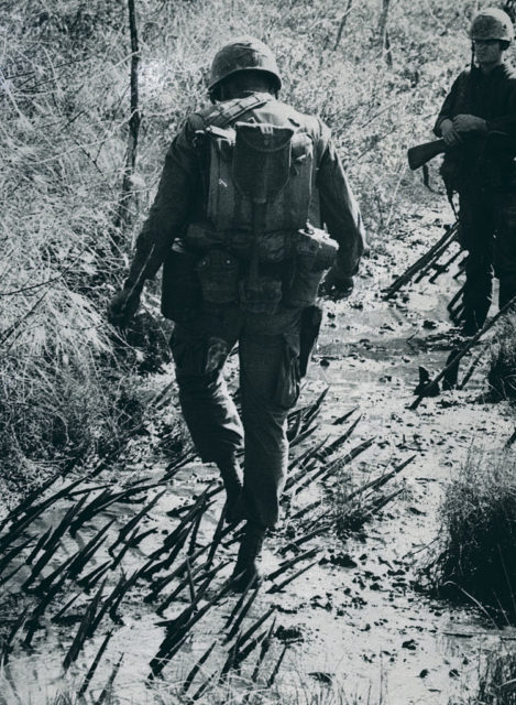 Lt. Don Burchell walking through Punji sticks