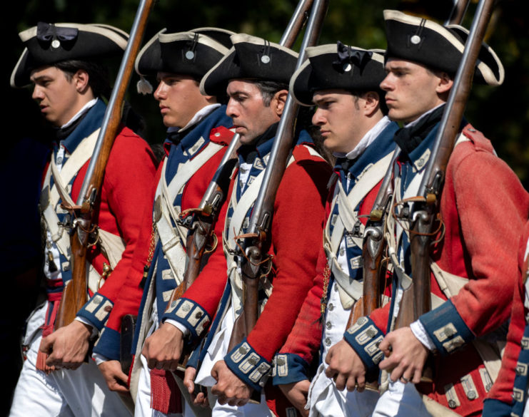 Five re-enactors dressed as British soldiers during the American Revolution