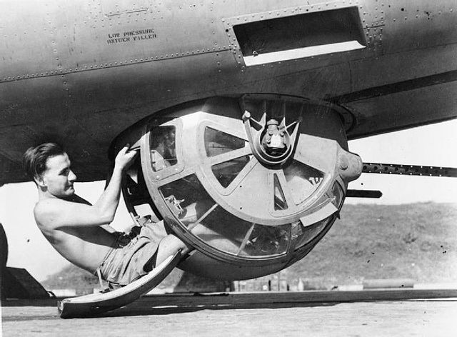 British air gunner climbing into a ball turret