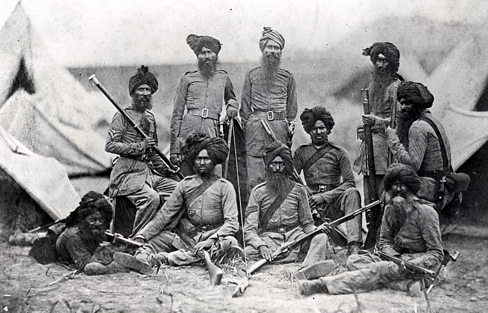 Sikh officers standing together in a makeshift camp