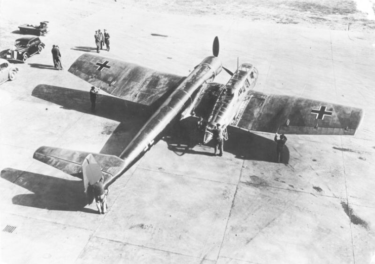 People standing around a Blohm & Voss BV 141 parked on the runway