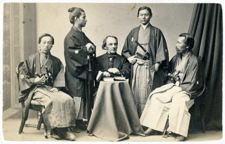 Charles K. Dillaway sitting with four students