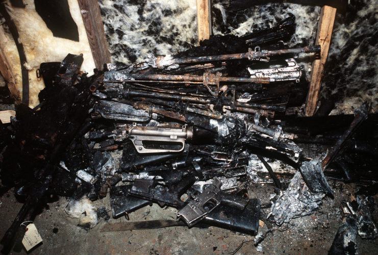 pile of charred weapons