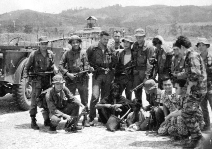 MACV-SOG members standing together outside