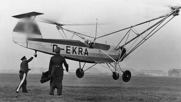 Focke-Wulf Fw 61 taking off while two men look on