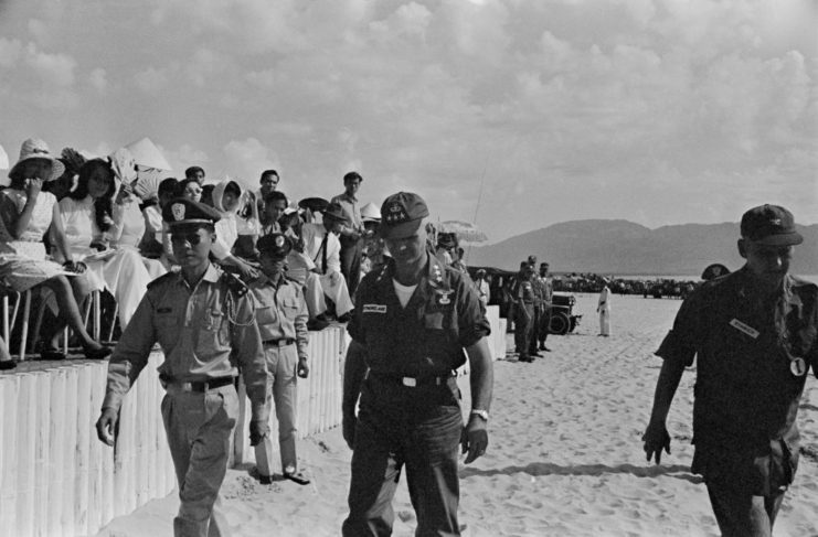 MACV SOG Commander General William Westmoreland walks with South Vietnamese military personnel